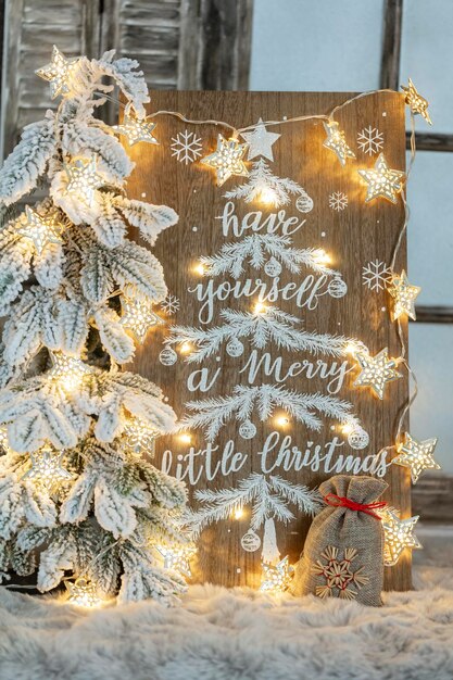 Board with Merry Christmas message on wooden background.