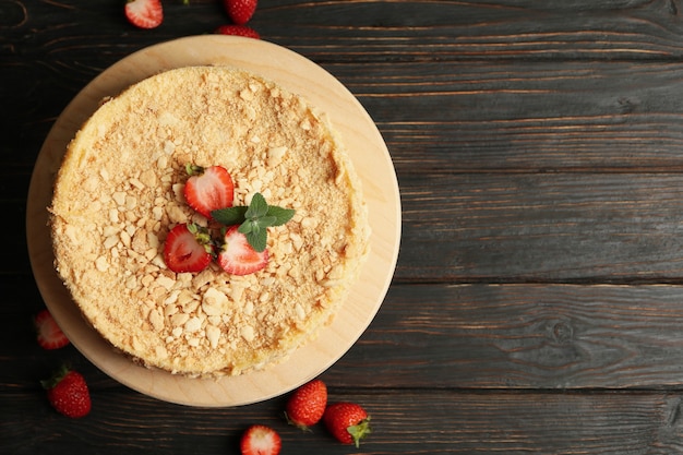 Board with Napoleon cake with strawberry