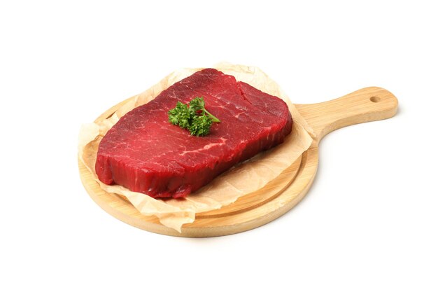 Board with raw beef steak isolated on white background