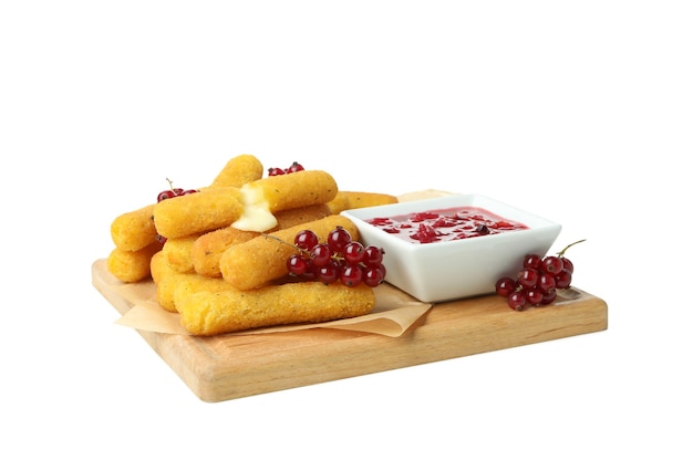 Board with tasty cheese sticks isolated on white background