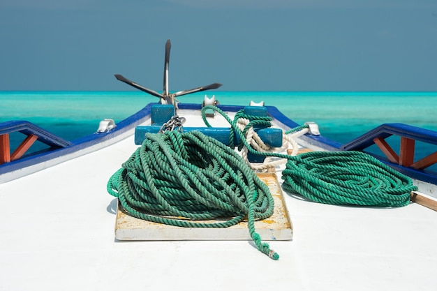 Boat bollard detail on blue water background