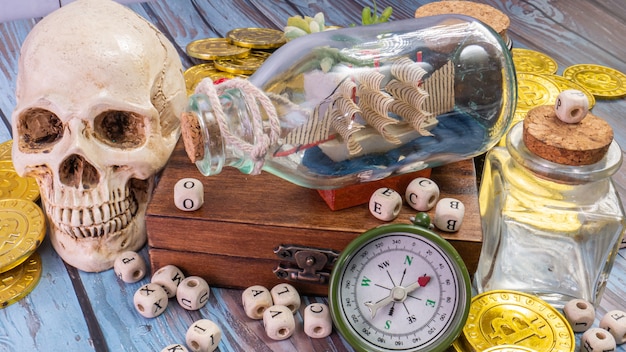 The boat in  bottle on wood table for travel or transport concept