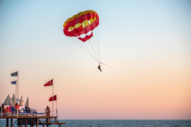 Boat dragging couples with clourfull parachute