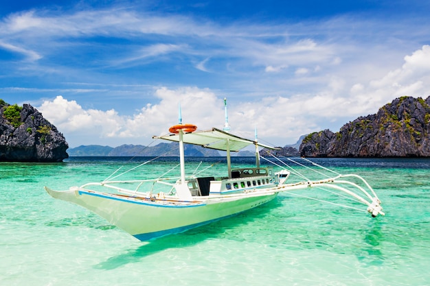 Boat floating on the clear water