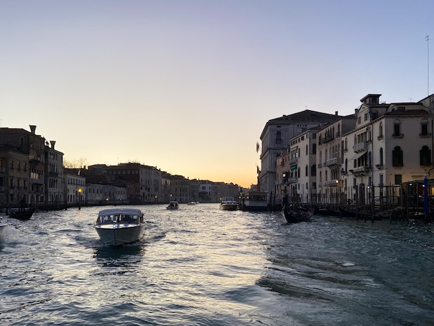 Boat in Grand Canal in Venice city in evening