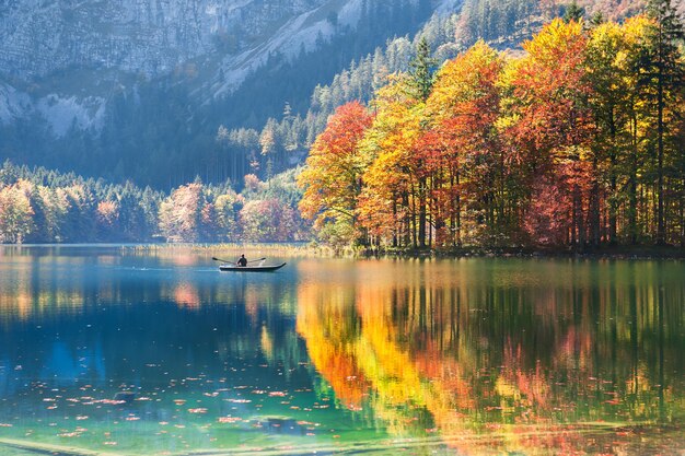 Boat on the Hinterer Langbathsee lake in Austrian Alps. Beautiful autumn landscape