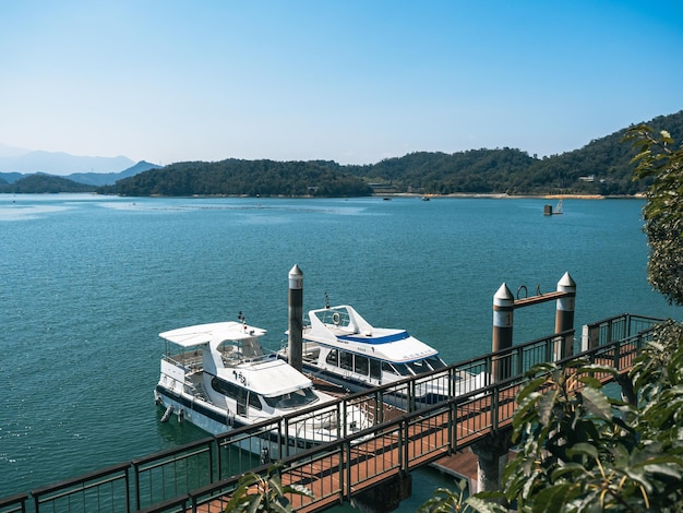 A boat is docked at the marina in the daytime.