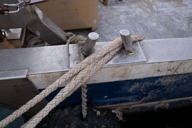 A boat is tied with two ropes and is ready to be loaded