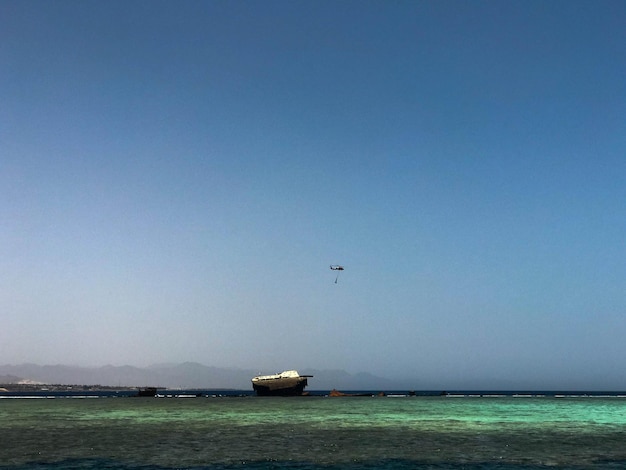 A boat is in the water with a flag on it