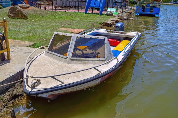 Boat on the lake with green nature background