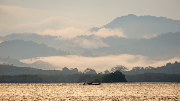 Boat in leak mountain blackground