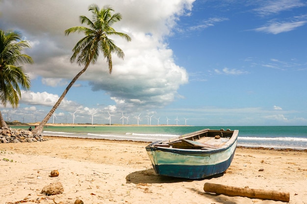 Boat moored on beach against sky