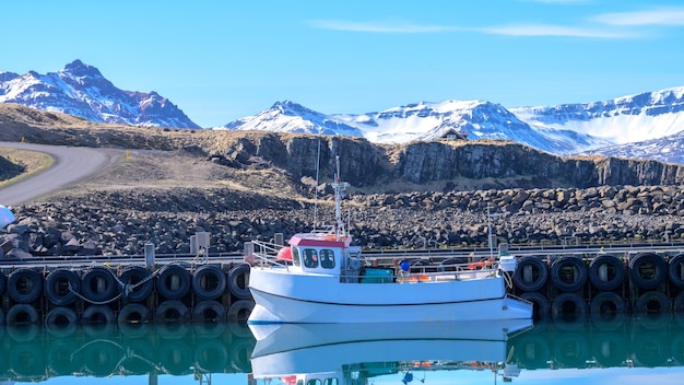 Boat moored to dock at pier in Iceland