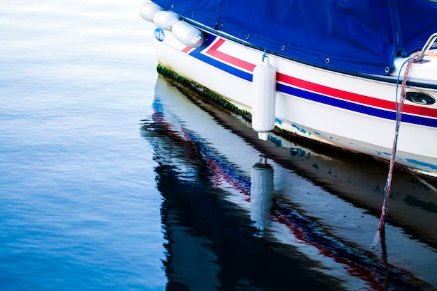 Boat Reflection on the Sea Water Photo