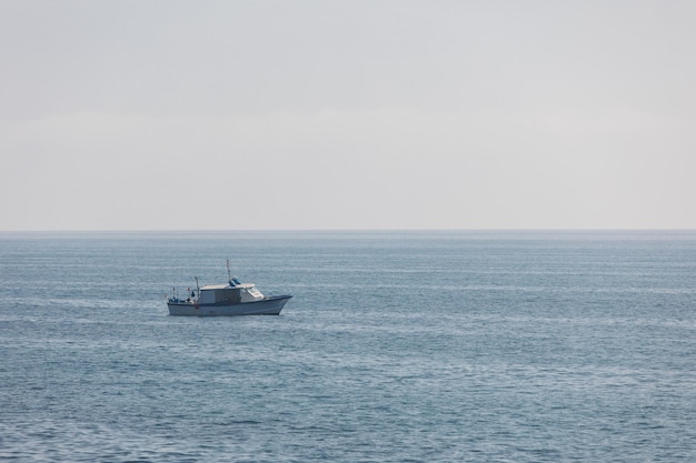 Boat sailing in the blue sea