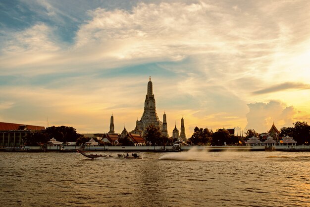 Boat sailing in the middle of the Chao Phraya river