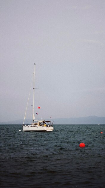 boat sailing on sea against clear sky