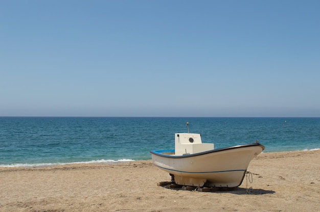 Boat in the sand on the beach