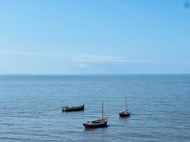 Boat in sea against sky