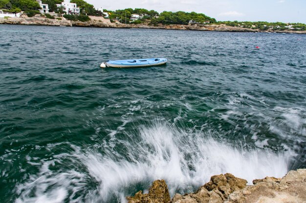 Boat in sea against sky