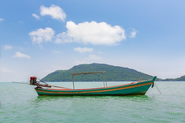Boat in the sea with blue sky and island in thailand