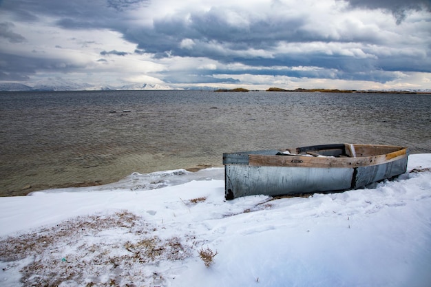 Boat on snow Winter landscape composition