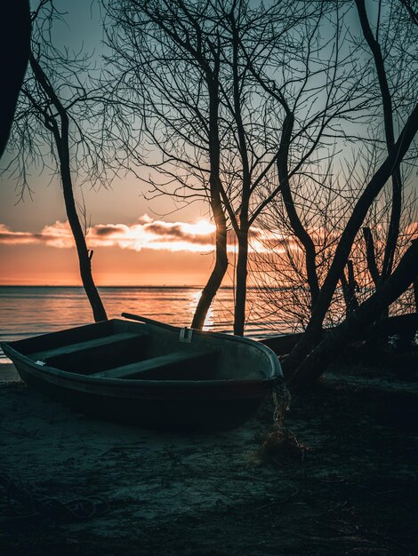 Boat at sunrise by the sea