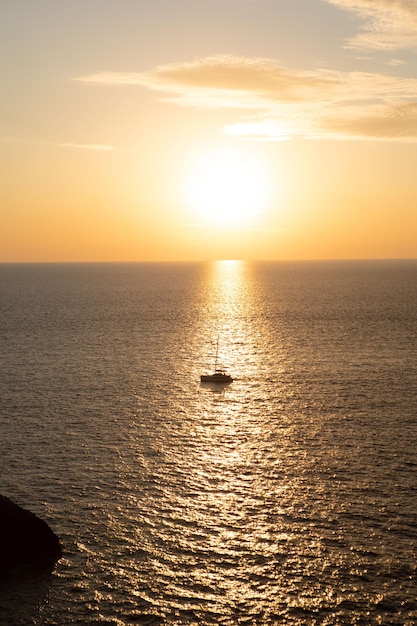 Boat on sunset in the sea