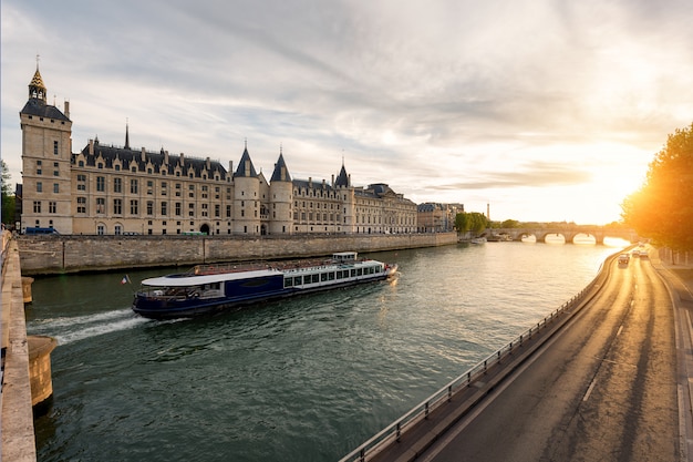 Boat tour on Seine river in Paris with sunset. Paris, France