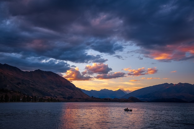 Boat on the water at sunset at Lake Wanaka