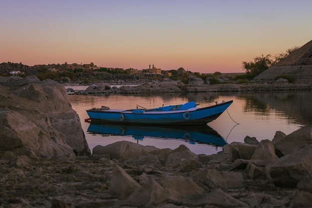 A boat on the water at sunset