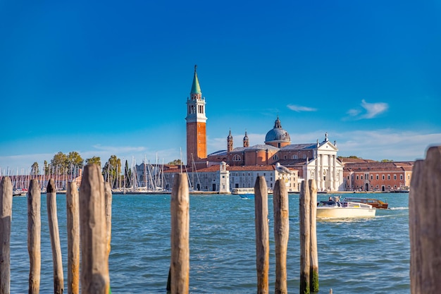 A boat in the water with the church of san marco in the background