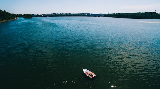 boat on water with red vivid color