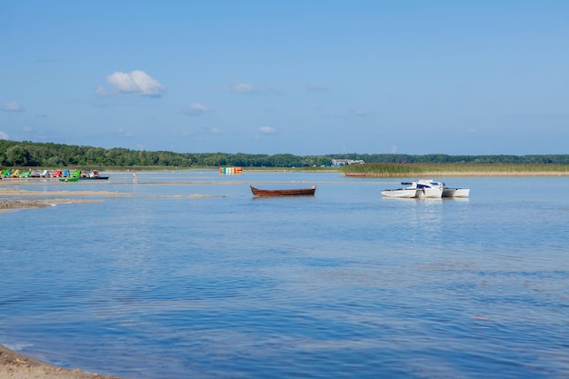 A boat in the water with the word beach on it