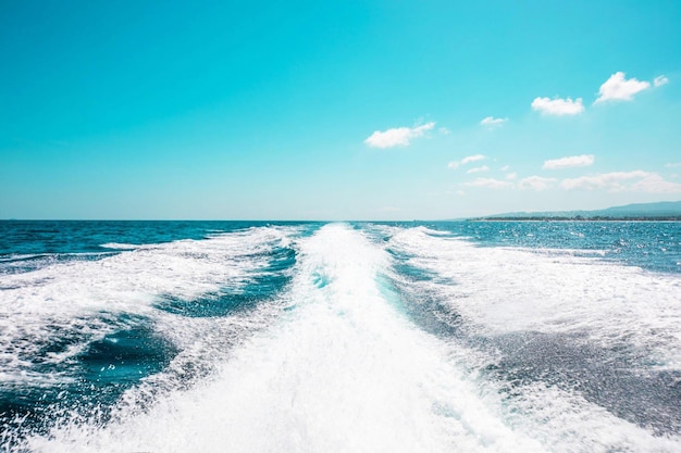 A boat with a blue sky and the words sea on it