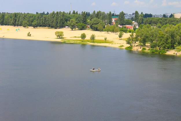 Boat with fishermen at the river Dnieper Ukraine