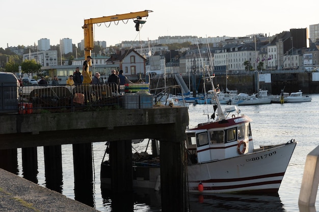 A boat with the word " liberte " on the side