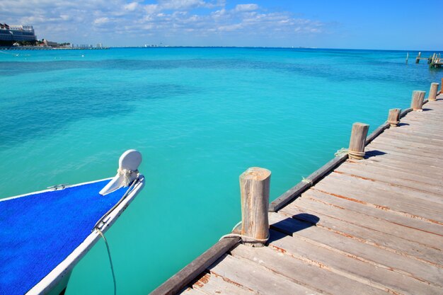 Boat in wood pier Cancun tropical Caribbean sea