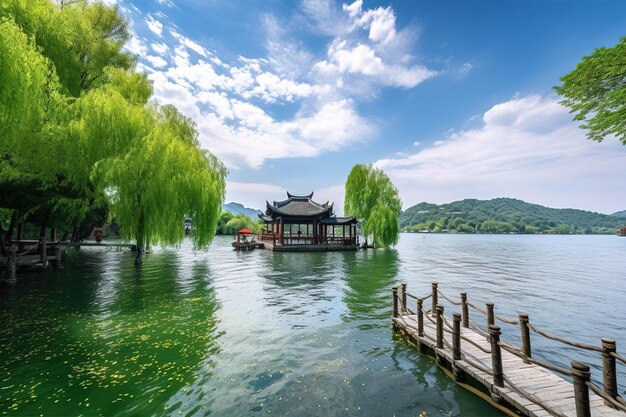 Photo a boathouse on the water with a green tree in the background