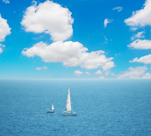 Boats in Alghero sea on a cloudy day