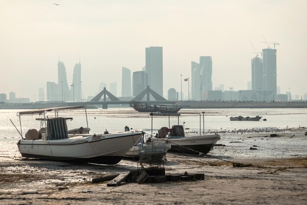 Boats and cityscpae view in the fishermans bay in Manama Bahrain