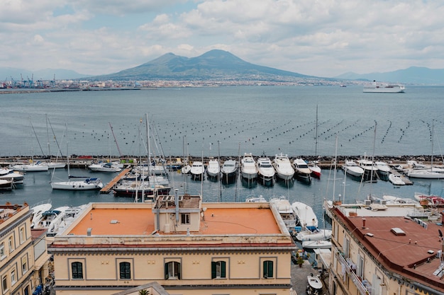 Boats docked at a pier in Naples, Italy