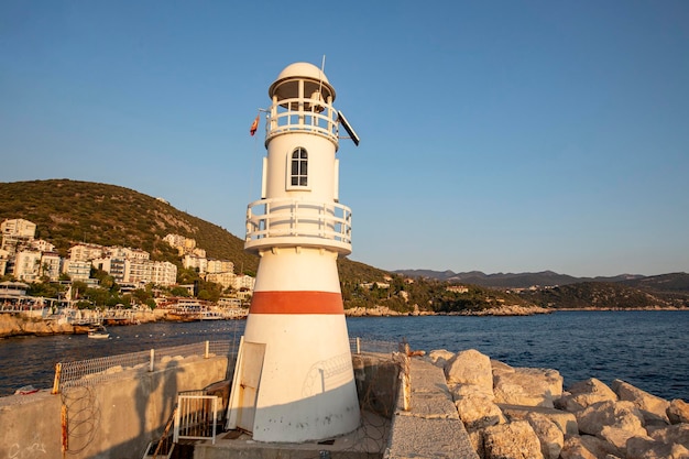 Boats and lighthouse in the port of Kas old town, Antalya, Turkey