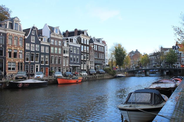 Boats moored on canal in city