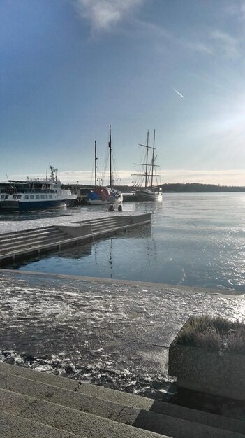 Boats moored at harbor