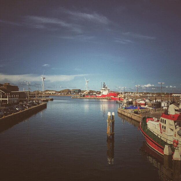 Boats moored at harbor