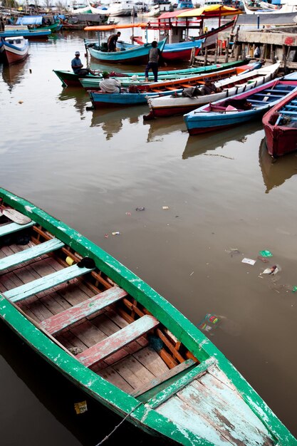 Boats moored at harbor