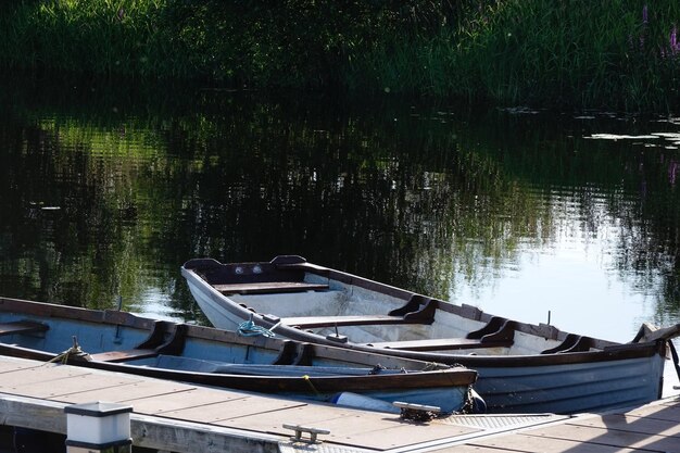 Boats moored in lake