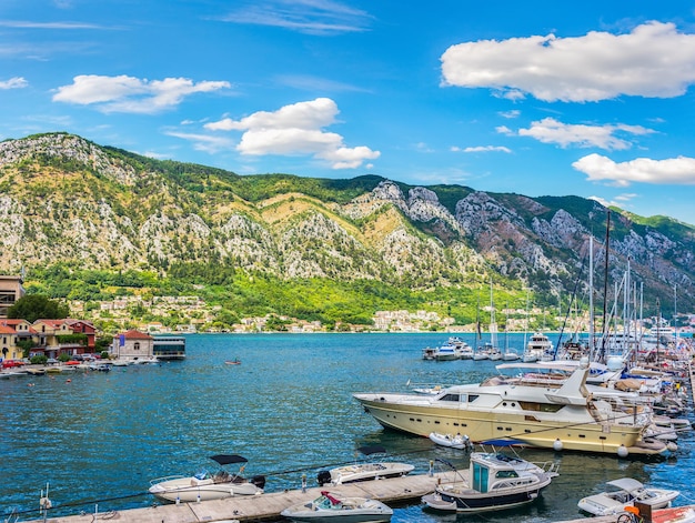 Boats moored near pier in Kotor bay, Montenegro