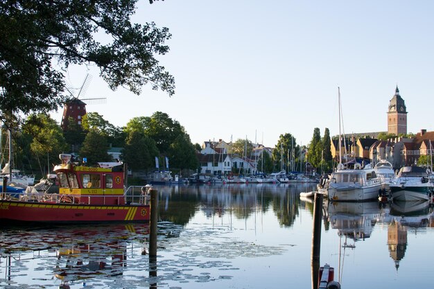 Boats moored in river